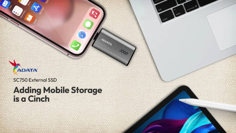 ADATA SC750 External SSD with smartphone, laptop, and tablet on a light surface